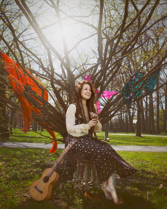 Mimi sitting underneath a tree